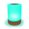 Cylindrical LED Lumi Friendship Lamp with wooden base and green light on a white background
