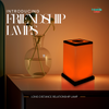 Person touching a Modern Design Friendship Lamp to send light to a loved one