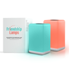 Two friendli Friendship Lamps in blue and orange colors, with a product box in the background, both on a white background.