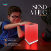 FriendLi friendship lamp on table being touched by a kid that make a glow of red