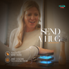 women touching mini mid century kona friendship lamp to send a virtual hug glowing teal