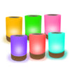 Set of four colorful cylindrical lights on a white background of Lumi Friendship Lamps