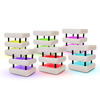 A set of six mini mid-century modern style friendship lamps in white and black colors, with a packaging box behind them.