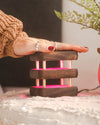 single mini mid century kona friendship lamp being touched to glow pink