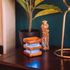 single mini mid century friendship lamp glowing blue