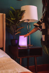 Single FriendLi Friendship lamp being touched glowing pink to be connected with loved ones