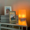 FriendLi Friendship lamp glowign orange with pictures of friends